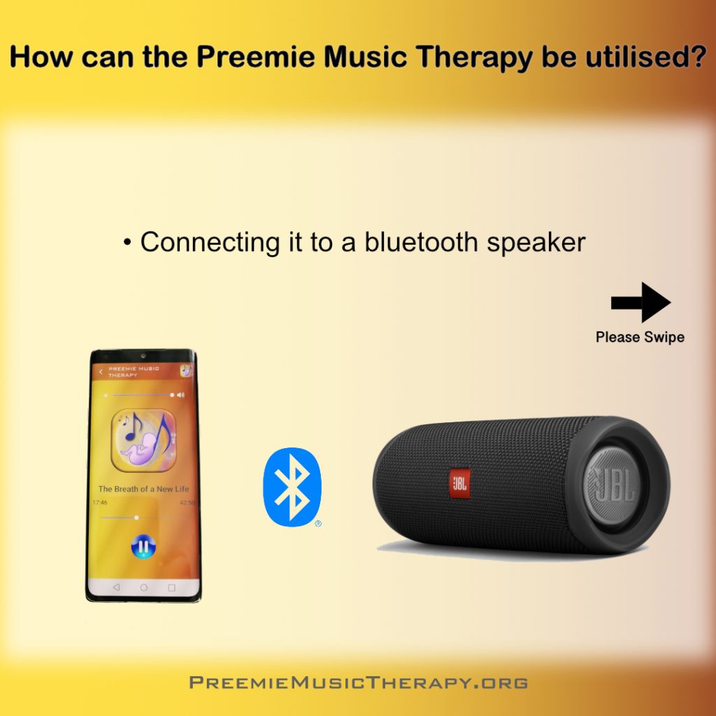 Smartphone with the App, playing baby music through a bluetooth speaker.