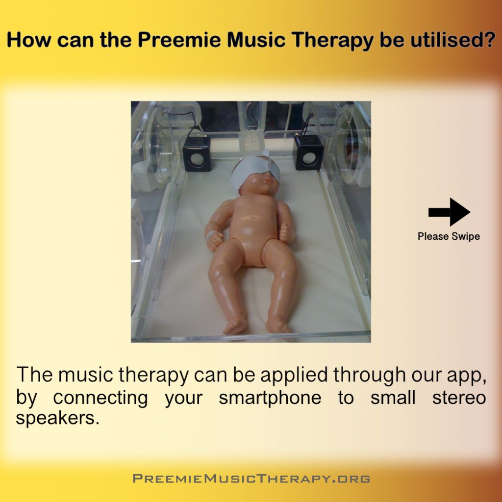 A premature baby in an incubator with 2 small speaker, playing a music therapy for premature babies.